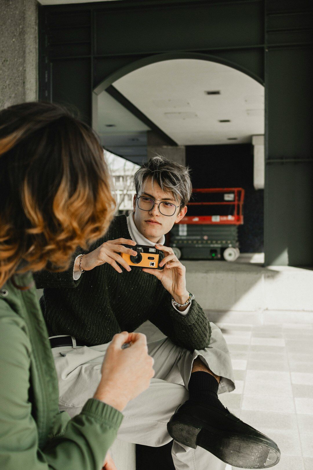 Journalist interviewing a guest in a professional studio setting