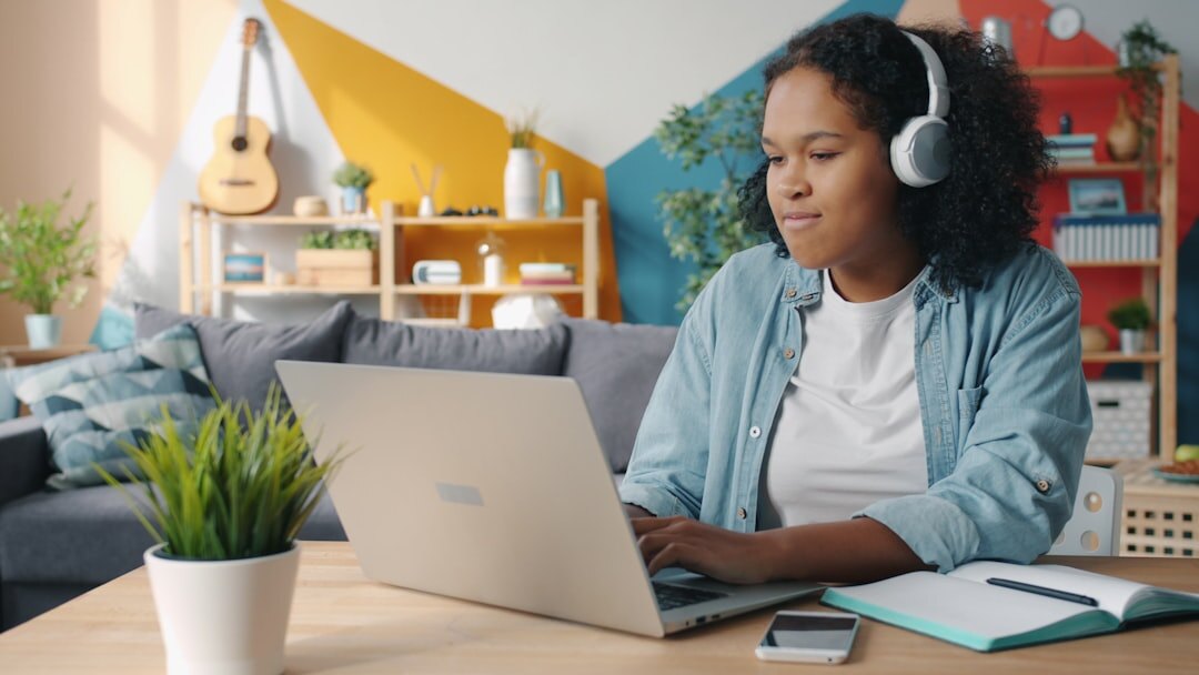 student studying at laptop