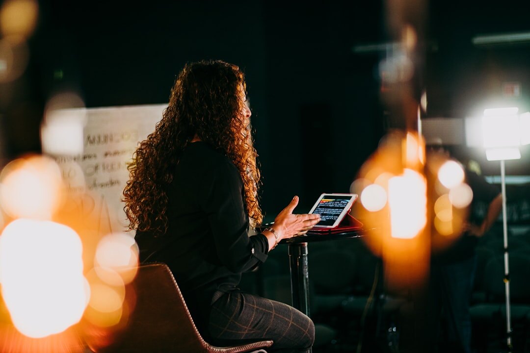 woman giving presentation on stage